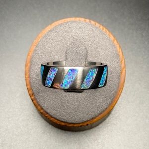 Size 12 Titanium Ring Inlaid With Burberry Purple Opal That Glows Green